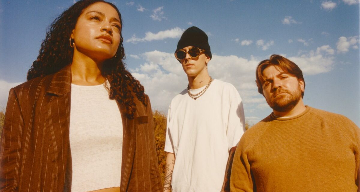 The latest single from indie pop trio WILD finds them “Sitting On Top Of The World” – Aipate